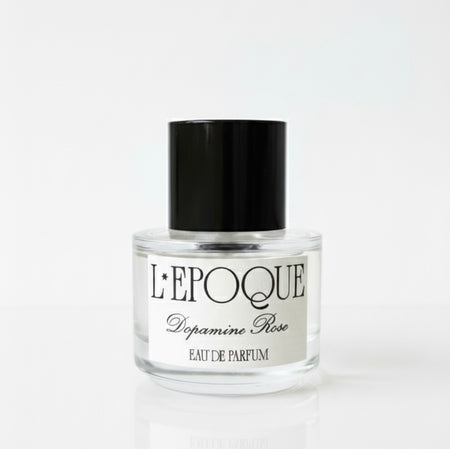 Perfume bottle labeled 'L'Epoque Dopamine Rose' on a white background