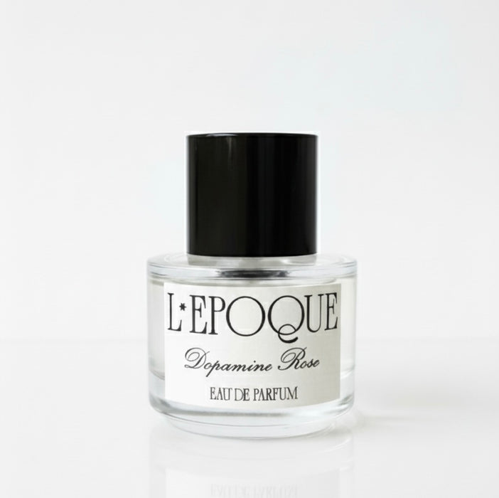 Perfume bottle labeled 'L'Epoque Dopamine Rose' on a white background