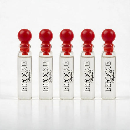 Five L'Epoque Parfums branded 1mL sample vials with red ball caps from the Discovery Set