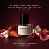 Dopamine Rose extrait de parfum by L'Epoque surrounded by strawberries, raspberries, toasted marshmallows, and rose petals on a burgundy background