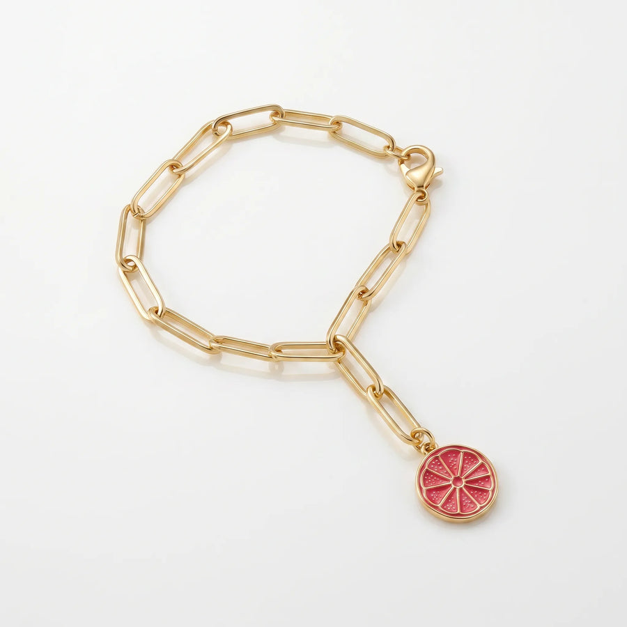 Serotonin Bottle Charm — gold-filled grapefruit slice charm in pink enamel on an adjustable gold link chain, a limited edition L'Époque Parfums x Little Charm Bar collaboration that clips to the Serotonin Spritz 30mL bottle