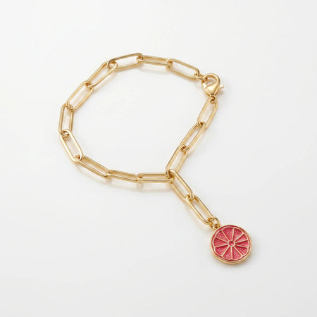 Serotonin Bottle Charm — gold-filled grapefruit slice charm in pink enamel on an adjustable gold link chain, a limited edition L'Époque Parfums x Little Charm Bar collaboration that clips to the Serotonin Spritz 30mL bottle