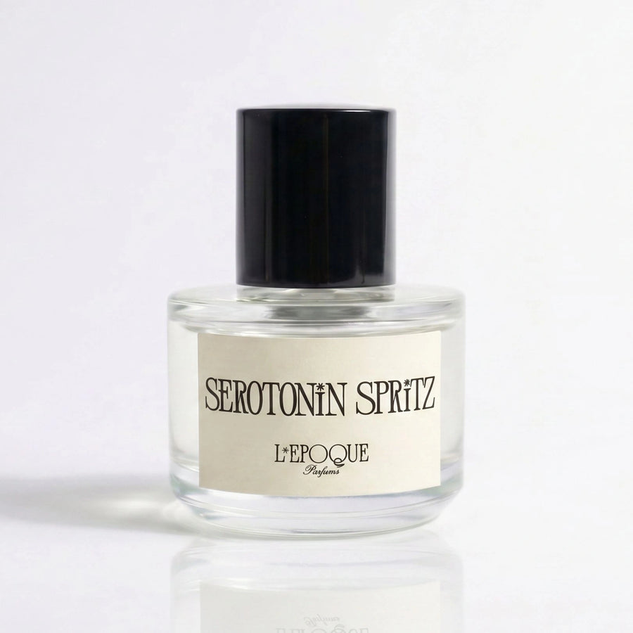 Serotonin Spritz Eau de Parfum 30mL bottle by L'Epoque — clear glass flacon with a black cap and cream label on a soft white background